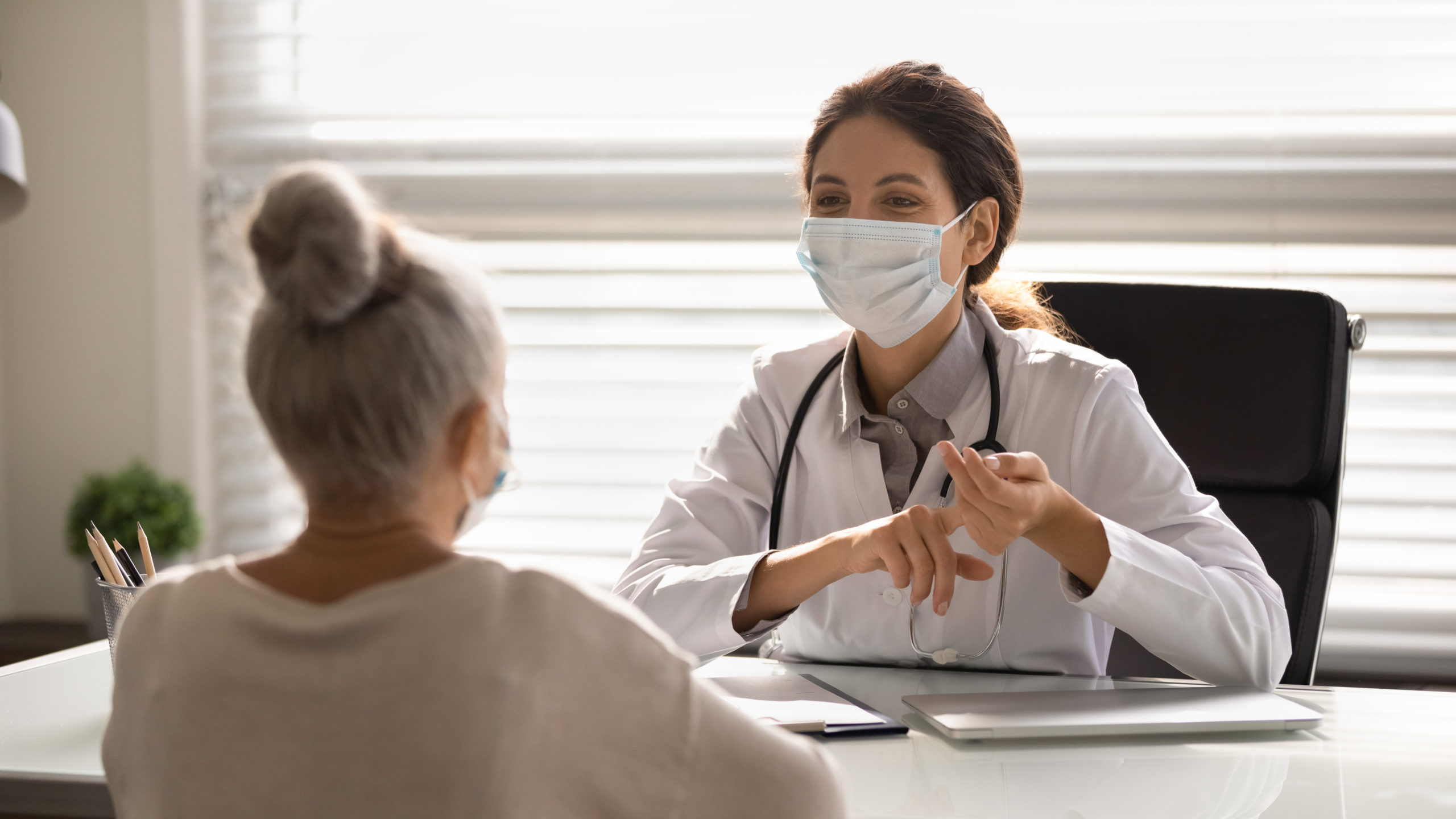  Doctor having a discussion with a patient in the office.