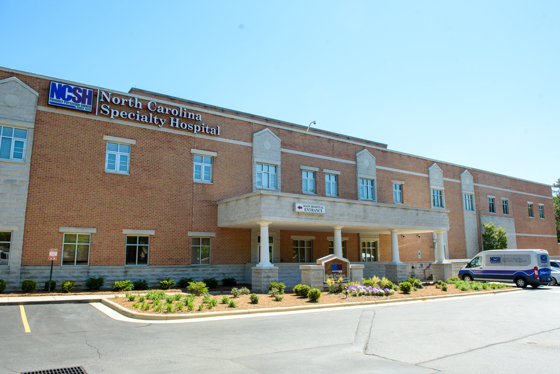  An exterior image of the brick, two-story North Carolina Specialty Hospital, where people have urology surgery. 