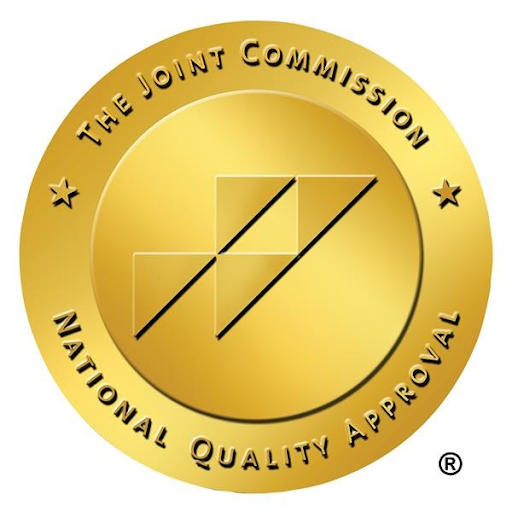 A gold circle that reads “The Joint Commission National Quality Approval.” 